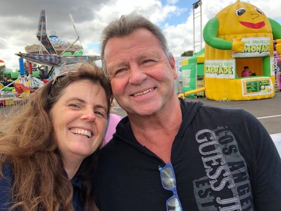 A man and woman smiling for the camera.