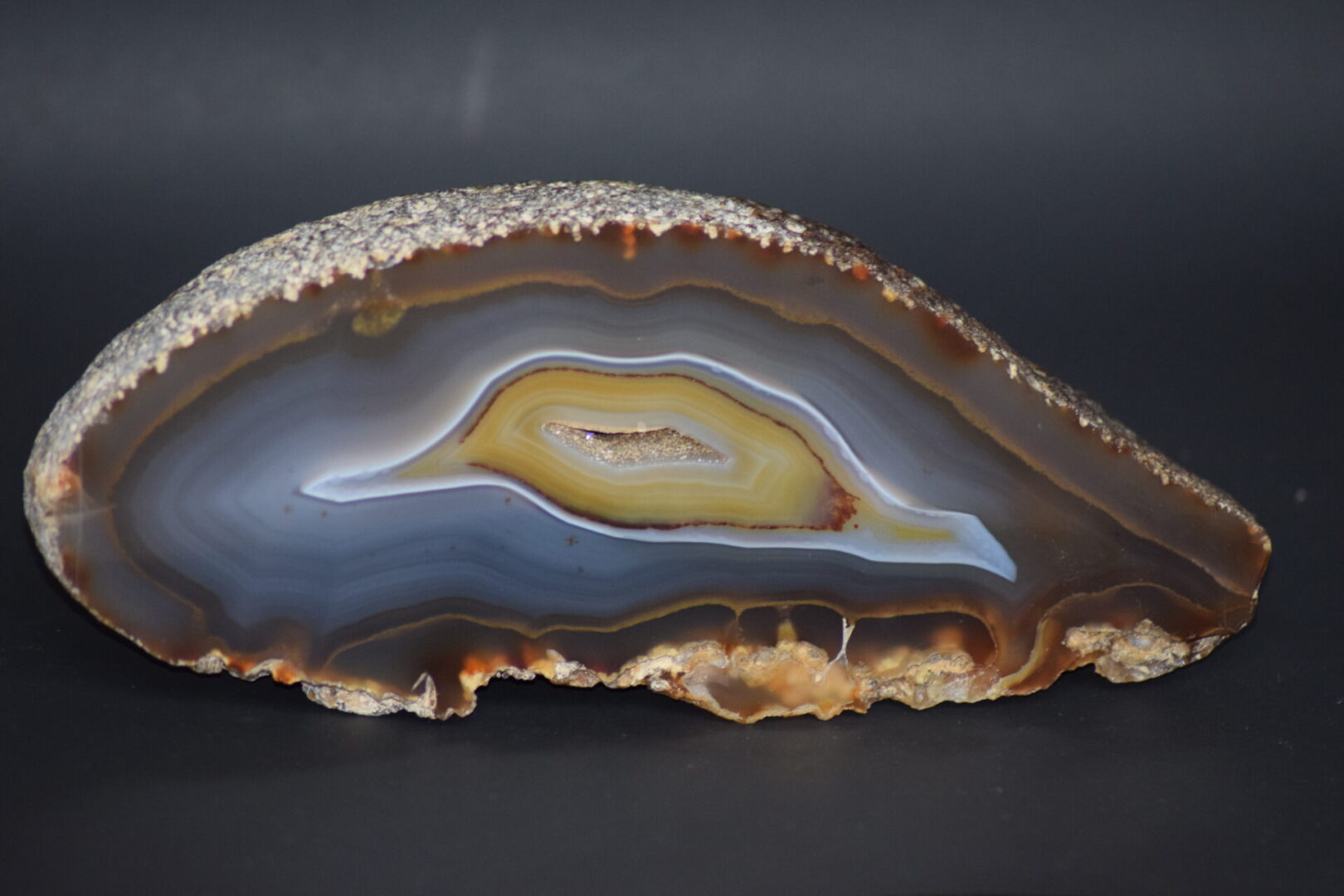 A close up of the side of an agate slice