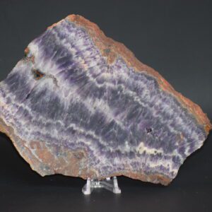 A slab of purple and white rock on top of a stand.