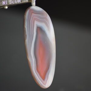 A close up of the bottom part of an agate slice.