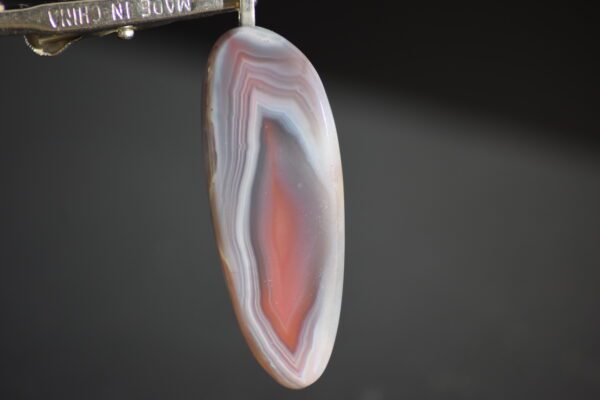 A close up of the bottom part of an agate slice.